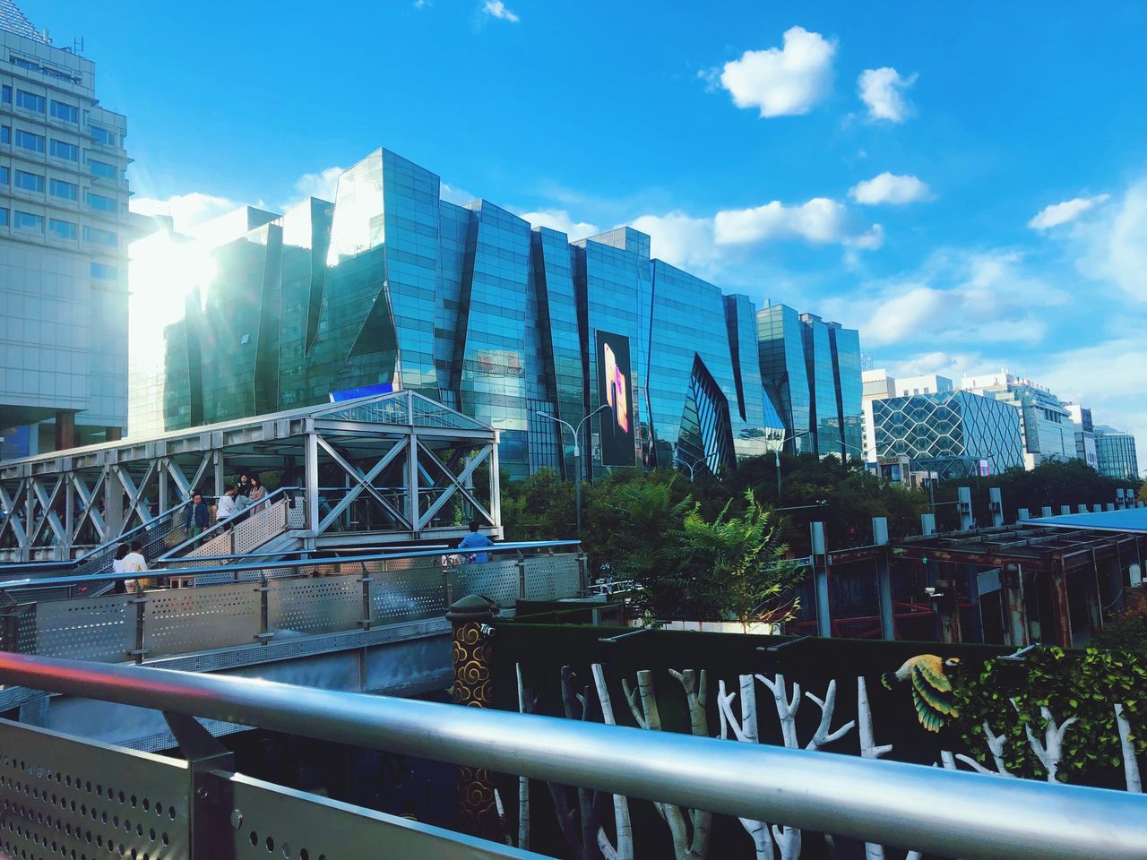 built structure, architecture, building exterior, sky, city, building, office building exterior, nature, cloud - sky, day, no people, office, modern, outdoors, sunlight, skyscraper, cityscape, blue, water, bridge - man made structure, financial district