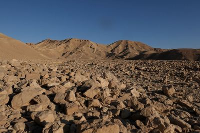 Arid landscape against clear blue sky