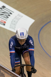 Rear view of man riding bicycle