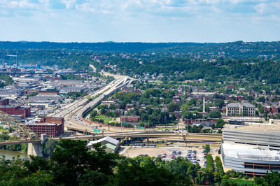 High angle view of trees and buildings against sky