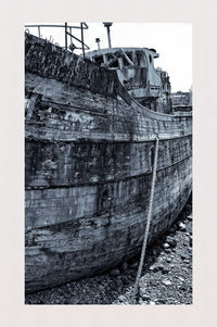 Abandoned boat against sky