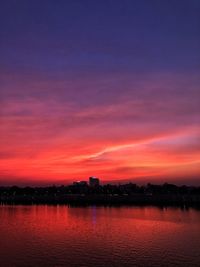 Scenic view of lake against romantic sky at sunset