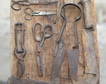 Close-up of chain hanging on wood