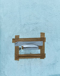 Close-up of open door on wall