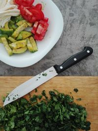 High angle view of chopped vegetables on cutting board