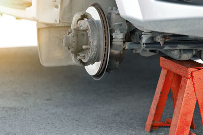 Close-up of machinery on road