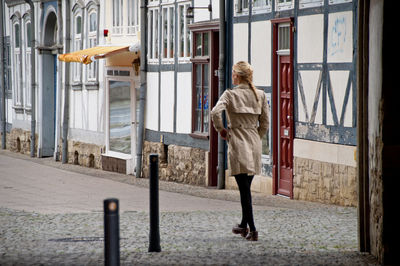 Rear view of woman walking in city