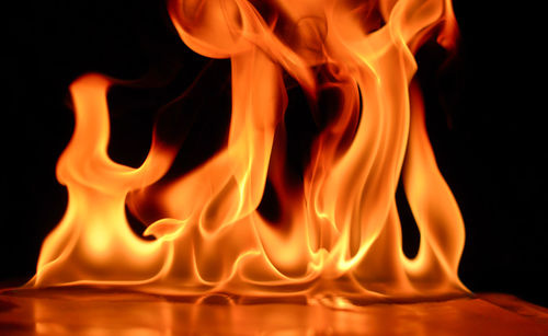 Close-up of fire against black background