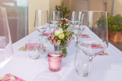 Wineglasses on dining table at wedding