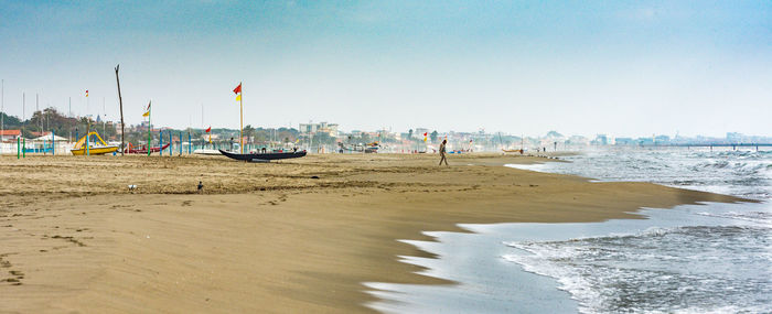 Scenic view of beach against clear sky