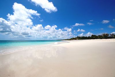 View of beach against cloudy sky