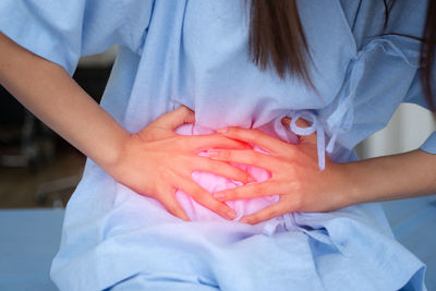 Close-up of woman holding hands