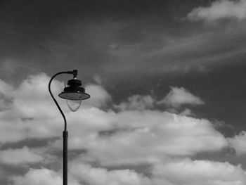 Low angle view of street light against sky