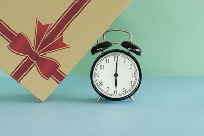 High angle view of alarm clock on table