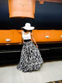 Rear view of woman standing by train