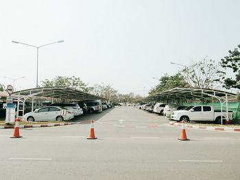 Road in city against clear sky