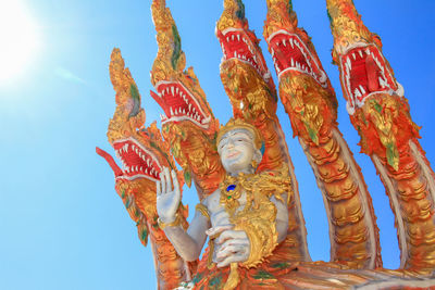 Low angle view of statue against sky