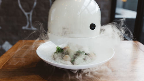 Smokey food served in bowl on table