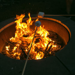 High angle view of burning fire on wood