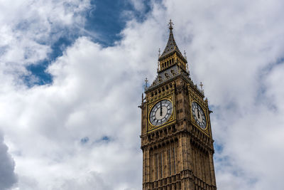 Low angle view of clock tower against sky