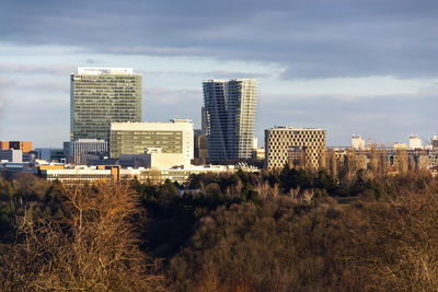 Buildings in city against sky