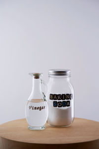 Close-up of glasses on table against white background