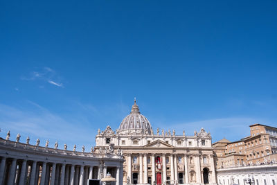 Low angle view of historical building against blue sky