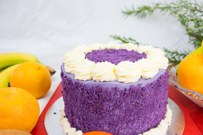 Close-up of cake and fruits on table during christmas