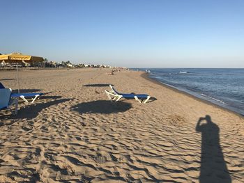 Scenic view of beach against clear sky