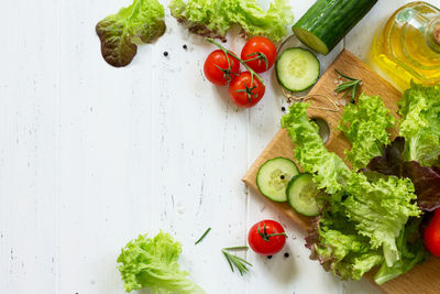 Ingredients cooking for summer salad on a white kitchen table. the concept of nutrition health. 