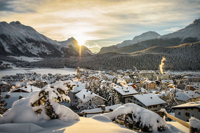 Scenic view of snowcapped mountains against sky during sunset