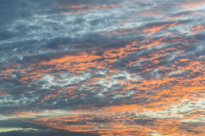 Low angle view of dramatic sky during sunset