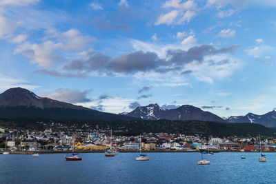 Panoramic view of townscape by sea against sky