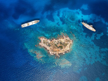 High angle view of man swimming in sea