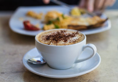 Close-up of cappuccino on table