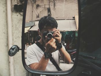 Woman photographing through camera