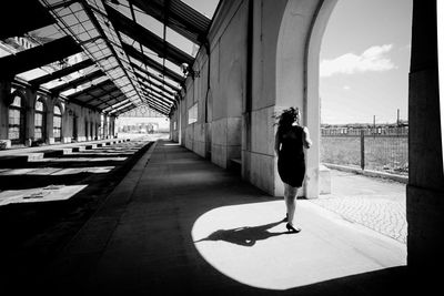 Rear view of woman on building