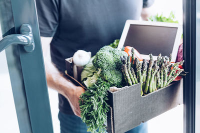 Midsection of man holding food