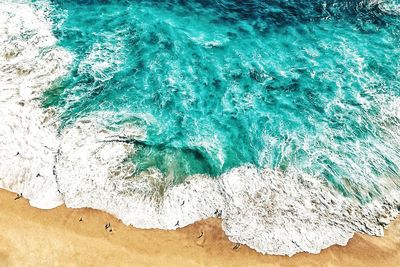 High angle view of surf on beach