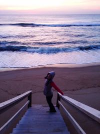 Full length of man on beach against sky