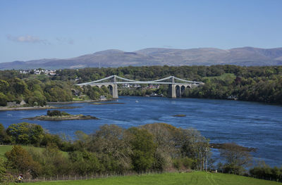 Bridge over river against sky