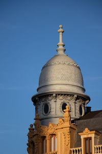 Low angle view of building against blue sky