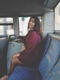 Young woman sitting in train