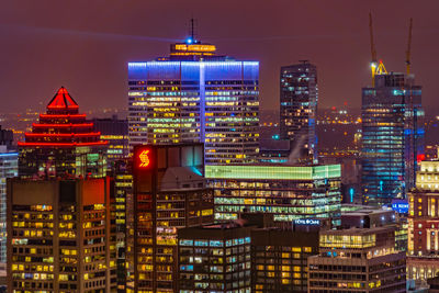 Illuminated buildings in city at night