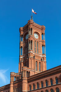 Low angle view of building against blue sky