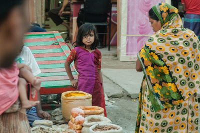 Rear view of girl holding ice cream