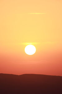 Scenic view of silhouette landscape against romantic sky at sunset