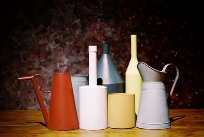 Close-up of watering can on table