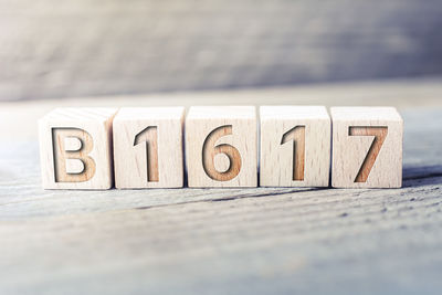 Close-up of text on wooden table