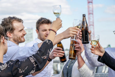 Group of people cheering in bar